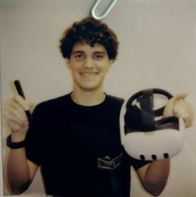 Juan, holding a VR headset